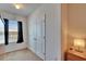 Bedroom featuring a window with dark curtains, carpet flooring and side table at 708 Barclay Wood Dr, Ruskin, FL 33570