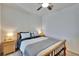 Bedroom featuring wooden bed frame, carpet flooring, and dual bedside tables at 708 Barclay Wood Dr, Ruskin, FL 33570