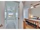 Entryway view of two bedrooms with fan lighting and carpeted floors at 708 Barclay Wood Dr, Ruskin, FL 33570