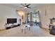 Spacious living room with ceiling fan, sliding glass doors to patio, and neutral carpet at 708 Barclay Wood Dr, Ruskin, FL 33570
