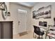 Office nook area features decor, black and white wall art, gray cabinet and tile flooring at 708 Barclay Wood Dr, Ruskin, FL 33570