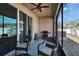 Screened in patio with wicker furniture, ceiling fan, and view of the backyard at 708 Barclay Wood Dr, Ruskin, FL 33570