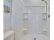 Modern shower stall with built-in shelving and a handheld shower head provides a spa-like experience at 708 Barclay Wood Dr, Ruskin, FL 33570