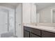 Stylish bathroom with a modern vanity, and bright lighting at 7756 Wheat Stone Dr, Zephyrhills, FL 33540