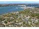 Stunning aerial view of waterfront homes nestled among lush trees with scenic bay and city views at 8236 36Th N Ave, St Petersburg, FL 33710