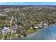 Gorgeous aerial view featuring waterfront homes, lush lawns, private docks, and serene bay access at 8236 36Th N Ave, St Petersburg, FL 33710