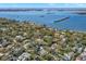 Panoramic aerial view showcasing a residential neighborhood near a vast body of water at 8236 36Th N Ave, St Petersburg, FL 33710