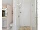 Bright bathroom featuring a clear glass shower, tile floor, vanity and toilet at 8236 36Th N Ave, St Petersburg, FL 33710