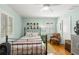 Bright bedroom with a full bed, a ceiling fan, and plenty of natural light from the windows at 8236 36Th N Ave, St Petersburg, FL 33710
