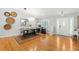 Dining area adjacent to the living room, featuring modern decor, hardwood floors, and ample lighting at 8236 36Th N Ave, St Petersburg, FL 33710