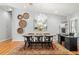 Bright dining room with decorative wall art, chandelier, and hardwood floors at 8236 36Th N Ave, St Petersburg, FL 33710