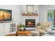 Living room fireplace with decorative mantel and nearby window showcasing a pool view at 8236 36Th N Ave, St Petersburg, FL 33710