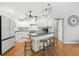 Well-equipped kitchen featuring white cabinets, modern appliances, granite counters, and a breakfast bar at 8236 36Th N Ave, St Petersburg, FL 33710