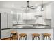 Bright kitchen featuring white cabinets, granite countertops, stainless appliances, and a breakfast bar at 8236 36Th N Ave, St Petersburg, FL 33710