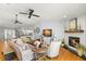 Open-concept living area with hardwood floors and fireplace near the kitchen at 8236 36Th N Ave, St Petersburg, FL 33710