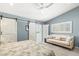 Cozy main bedroom with a plush king bed, shuttered windows, and comfortable sitting area at 8236 36Th N Ave, St Petersburg, FL 33710