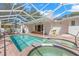 Beautiful screened-in pool with brick patio and plenty of room for entertaining on a sunny day at 8236 36Th N Ave, St Petersburg, FL 33710
