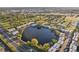 Wonderful aerial view of the apartment complex next to a golf course and lake at 825 N Keene Rd # U15, Clearwater, FL 33755