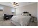 Comfortable bedroom with natural light, desk, and a cozy bed at 8780 Flourish Dr, Land O Lakes, FL 34637
