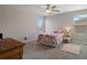 Cozy bedroom featuring a double window and a comfy bed at 8780 Flourish Dr, Land O Lakes, FL 34637