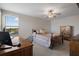 Bedroom with a desk, computer, and wooden furniture at 8780 Flourish Dr, Land O Lakes, FL 34637