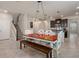 Dining area featuring stairs to the second floor and open access to kitchen at 8780 Flourish Dr, Land O Lakes, FL 34637