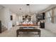 Dining area showcasing the kitchen featuring granite counters, stainless appliances, and dark cabinetry at 8780 Flourish Dr, Land O Lakes, FL 34637