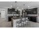 Spacious kitchen with granite countertops, stainless steel appliances, and a center island at 8780 Flourish Dr, Land O Lakes, FL 34637