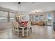 Open concept living and dining area filled with natural light and views of the lake at 8780 Flourish Dr, Land O Lakes, FL 34637