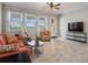 Bright Gathering room featuring a view of the lake through large windows at 8780 Flourish Dr, Land O Lakes, FL 34637