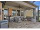 Screened-in lanai with a seating area, and a ceiling fan at 8780 Flourish Dr, Land O Lakes, FL 34637