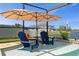 Relaxing pool with chairs in the water, offering a unique and enjoyable way to cool off at 8780 Flourish Dr, Land O Lakes, FL 34637