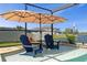 Swimming pool featuring submerged chairs, a lake view, and a red fire hydrant at 8780 Flourish Dr, Land O Lakes, FL 34637