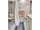 Bright bathroom featuring tiled shower with seating, neutral walls, and a comfort-height toilet at 9950 62Nd N Ter # 319, St Petersburg, FL 33708