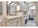 Updated bathroom features modern vanity and convenient laundry area at 9950 62Nd N Ter # 319, St Petersburg, FL 33708