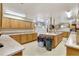 Spacious kitchen with light wood cabinets, an island, and functional design at 9950 62Nd N Ter # 319, St Petersburg, FL 33708