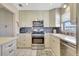Bright kitchen featuring stainless steel appliances, mosaic backsplash, and lots of counter space at 9950 62Nd N Ter # 319, St Petersburg, FL 33708