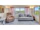 Comfortable living room boasts lots of natural light and stunning views of the community's lush landscaping at 9950 62Nd N Ter # 319, St Petersburg, FL 33708