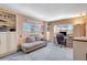 Inviting office space featuring built-in shelving, large windows, and a comfortable seating area at 9950 62Nd N Ter # 319, St Petersburg, FL 33708