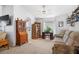 Cozy living room featuring carpeted floors, ceiling fan and a large window at 7511 Terrace River Dr, Temple Terrace, FL 33637