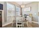 Cozy breakfast nook featuring a round table and lots of light from two large windows at 11141 Spring Point Cir, Riverview, FL 33579