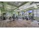 The fitness center boasts modern equipment, multiple TVs, and scenic views at 11141 Spring Point Cir, Riverview, FL 33579