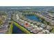 Aerial view showcasing lakefront homes in a peaceful residential neighborhood at 11422 Captiva Kay Dr, Riverview, FL 33569