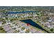 An aerial view showing the home's location on a serene community pond at 11422 Captiva Kay Dr, Riverview, FL 33569