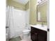 Full bathroom with a tub-shower combo, dark vanity, and neutral wall color at 11422 Captiva Kay Dr, Riverview, FL 33569