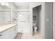 Bright bathroom featuring a walk-in shower with grab bars and neutral tile at 11422 Captiva Kay Dr, Riverview, FL 33569