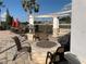 Outdoor firepit area with seating, lighting, and landscaped surroundings at 11422 Captiva Kay Dr, Riverview, FL 33569