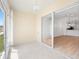 Bright Florida room with decorative lighting, tile flooring, and sliding glass doors at 11422 Captiva Kay Dr, Riverview, FL 33569