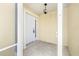 Welcoming front porch featuring a white door with glass pane and overhead lighting fixture at 11422 Captiva Kay Dr, Riverview, FL 33569