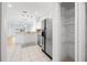 Bright kitchen with stainless appliances, ample storage, and a pantry at 11422 Captiva Kay Dr, Riverview, FL 33569